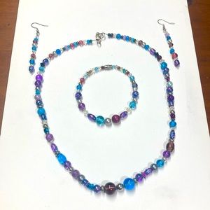 Handmade beaded jewelry set in purple and turquoise.